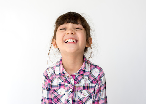 child smiling after recieving treatment at Portola Smiles