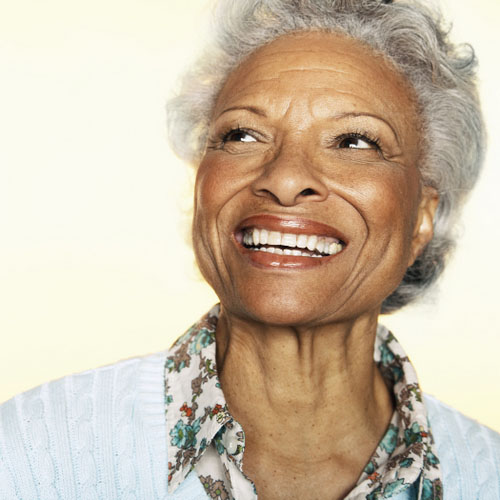 <br title='b11'>women smiling after recieving dental implant restoration